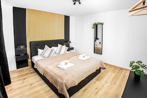 1 bedroom, desk, iron/ironing board, travel cot