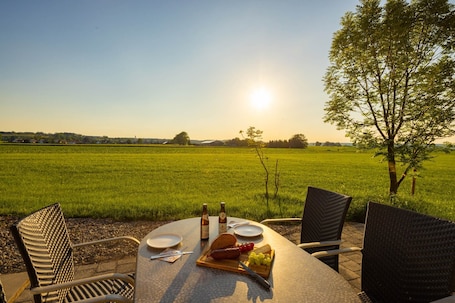 Outdoor dining. Apartment 'Ferienwohnung Egg-Hof' with Mountain View, Private Terrace and Wi-Fi