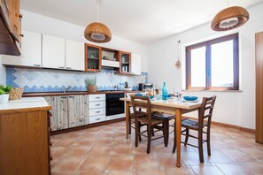 Family Apartment, Multiple Bedrooms (The Blue Whale) | Private kitchen | Fridge, microwave, oven, stovetop - The Blue Whale (La Maddalena)