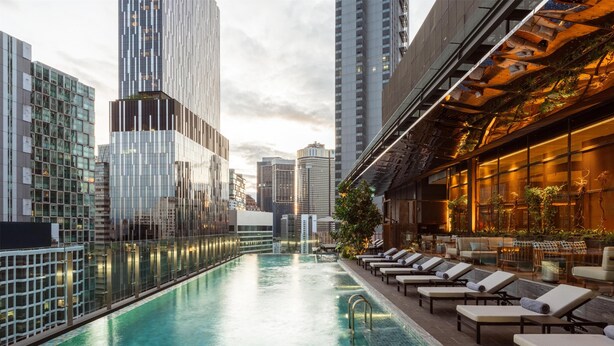 A rooftop pool with lounge chairs and a bar area, surrounded by high-rise buildings. - Hyatt Centric City Centre Kuala Lumpur (Kuala Lumpur)