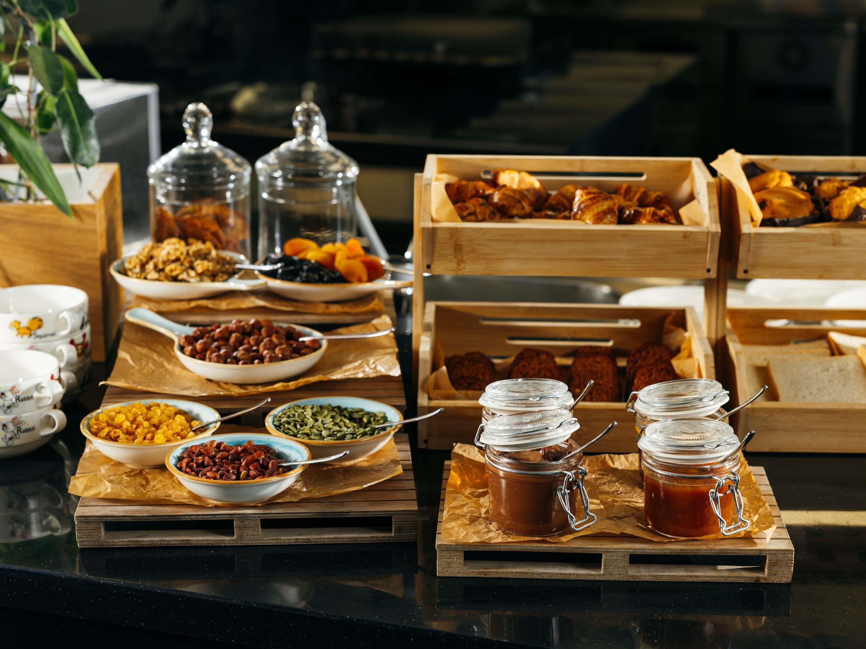 A breakfast buffet with various food items and condiments.
