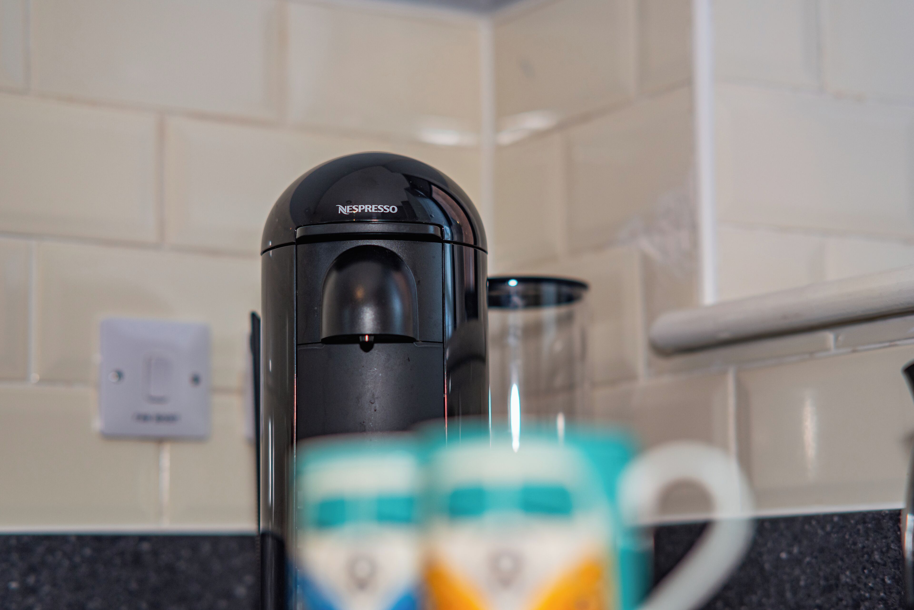 A Nespresso coffee machine on a kitchen counter.