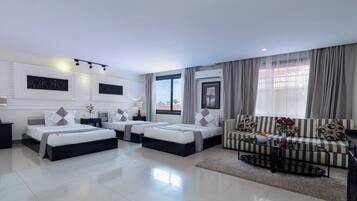 Deluxe Triple Room, Balcony | In-room safe, desk, laptop workspace, free WiFi