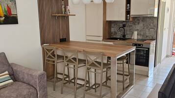 Apartment (Two Bedroom Apartment with Terrace) | Living room | 32-inch flat-screen TV with cable channels