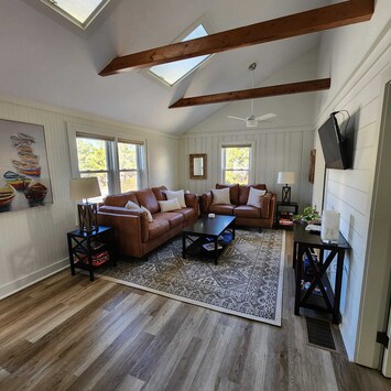 Gather & unwind in our cozy living room with plush seating & natural light.