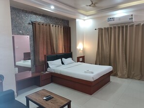 Deluxe Room | Bathroom | Bathrobes, slippers, bidet, toilet paper - HOTEL SUDAKSHINA BY ROH (Silchar)