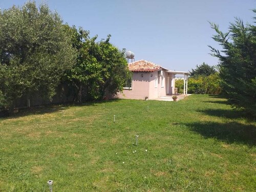 Charming 1-bedroom villa in serene Shkoder with WiFi, AC and Garden view.