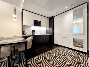Suite, Balcony | Private kitchenette | Fridge, microwave, stovetop, dishwasher