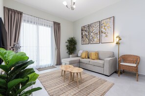 Comfort Apartment, Balcony | Living area - Waves - Stylish 1BR Close to IMG World & Global Village  (Dubai)