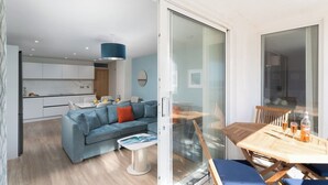 A modern apartment with a living room, dining area, and kitchen. - 3 St Nicholas Court - St Ives (St Ives)