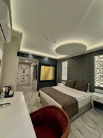 Deluxe Double Room, City View | In-room safe, desk, laptop workspace, blackout drapes