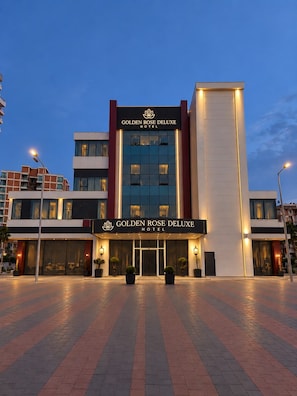 A hotel with a modern facade, a prominent entrance, and a well-lit exterior. - Golden Rose Deluxe Hotel (Manisa)