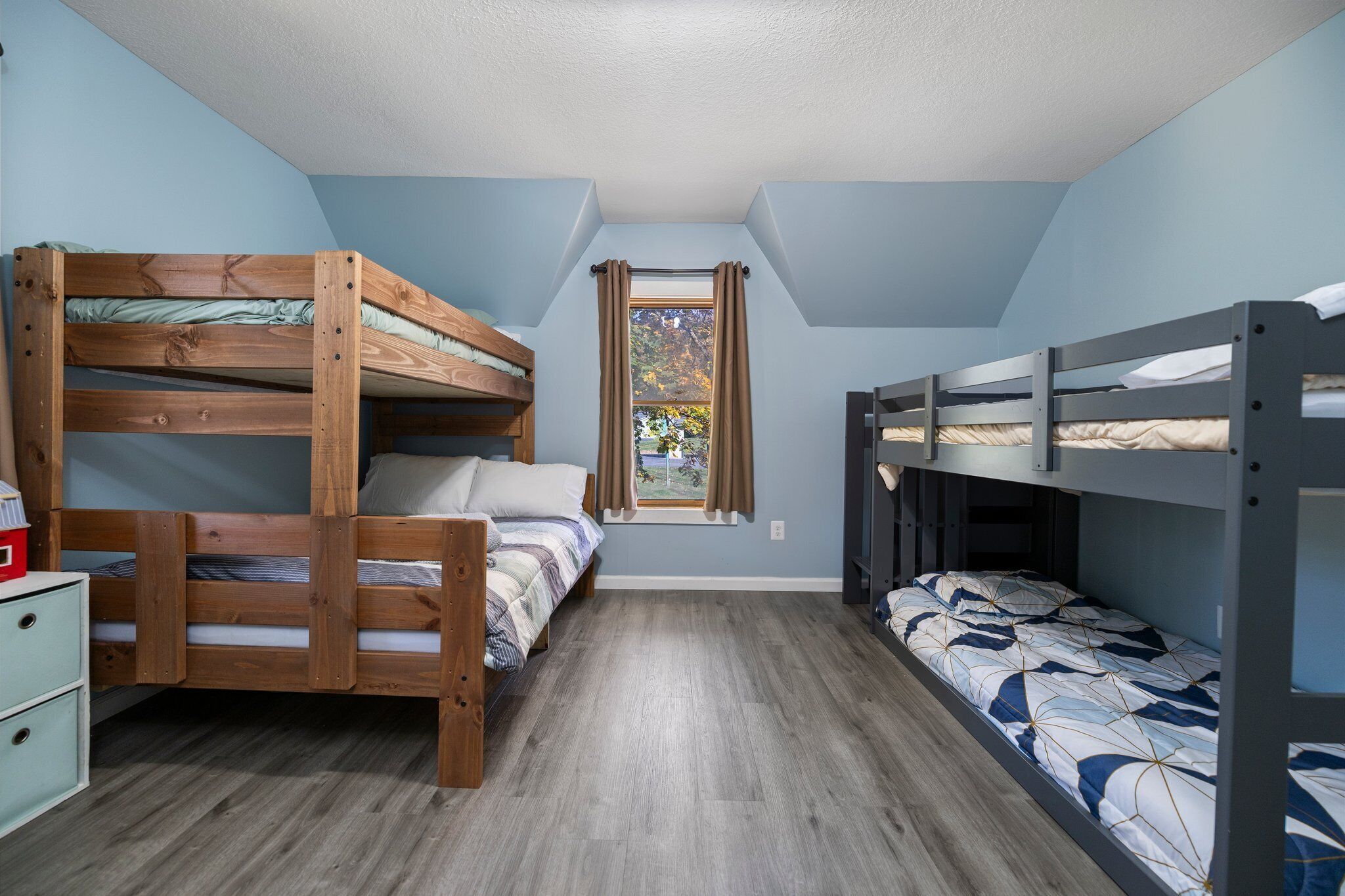 Kids room.  Toys, a full bed, three single beds