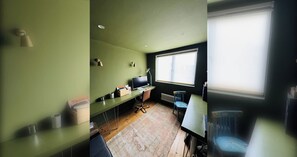 A room with a desk, computer, chair, and a radiator. - Stylish 4-Bedroom House in Vibrant Walthamstow (Greater London)