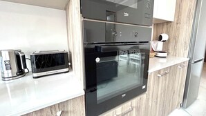 A modern kitchen with a built-in oven, a toaster, and a coffee maker. - St.Julian's Brand New apartments (1)

Walking distance to St Julians Paceville

 (Swieqi)