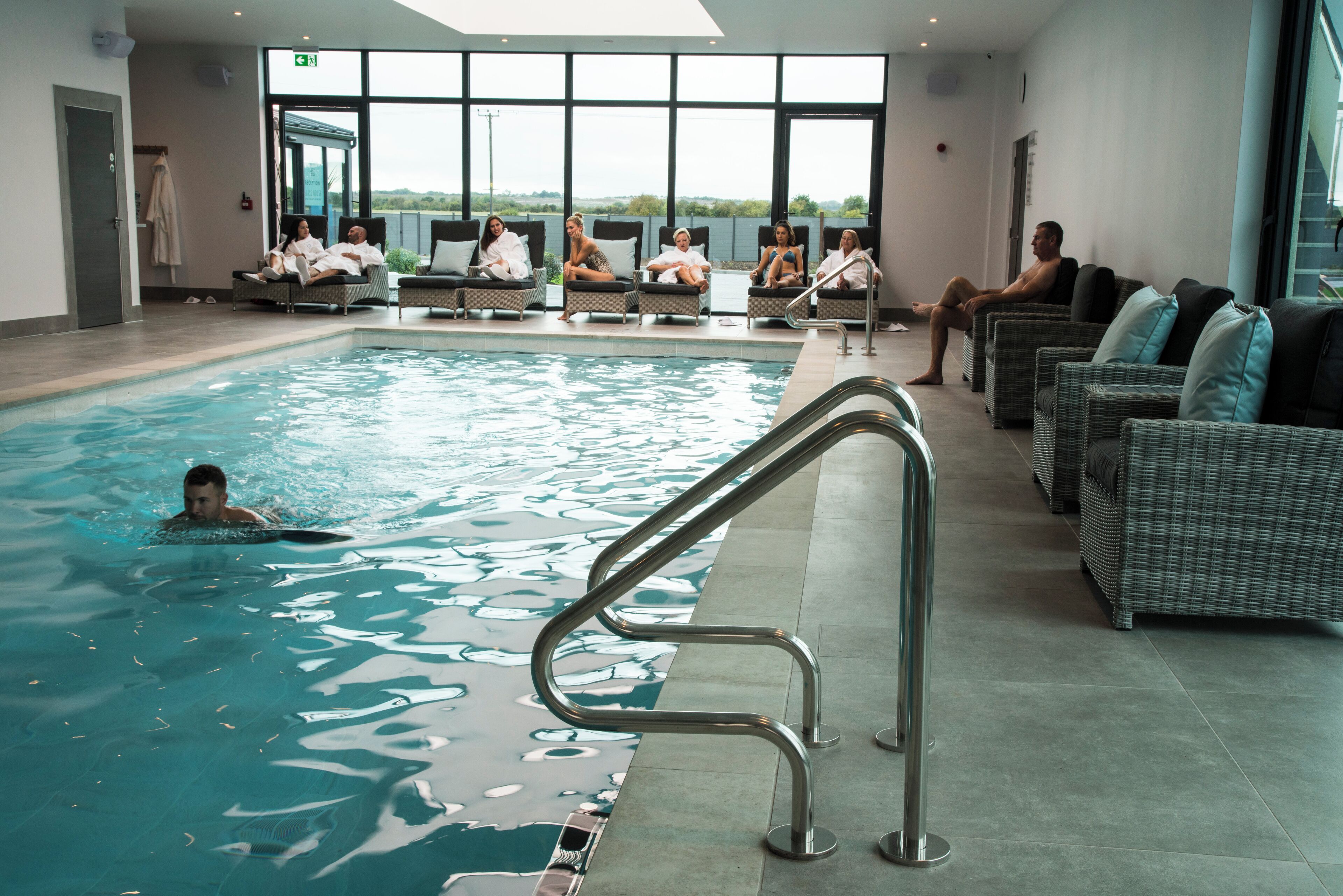 Indoor pool, open 8:00 AM to 7:00 PM, pool umbrellas, pool loungers