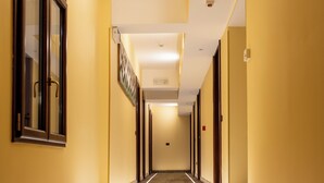 A hotel hallway with a staircase leading to the upper floors. - La Locanda di Castromediano (Castelmezzano)