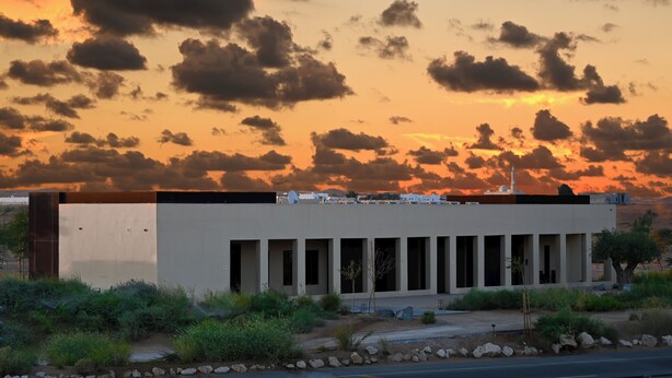 A modern building with a flat roof, rectangular windows, and a flat facade. - Al Faya Retreat by Sharjah Collection (Al Madam)