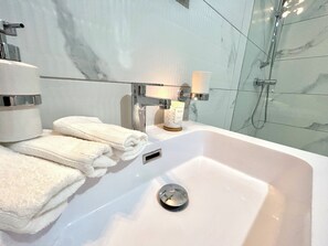 Hair dryer, towels, soap, toilet paper