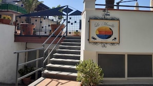 A staircase leading to a building with a sign reading "Le Marelle". - Le Marelle  (Furore)