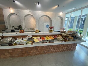 Enjoy a wide selection of fresh fruits, vegetables, and prepared dishes at our buffet.
