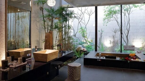 A modern bathroom with a large mirror, wooden vanity, and potted plants. - Mulan Boutique Hotel - Taipei Dazhi Branch (Taipei)