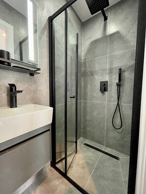 Shower, hair dryer, towels, soap