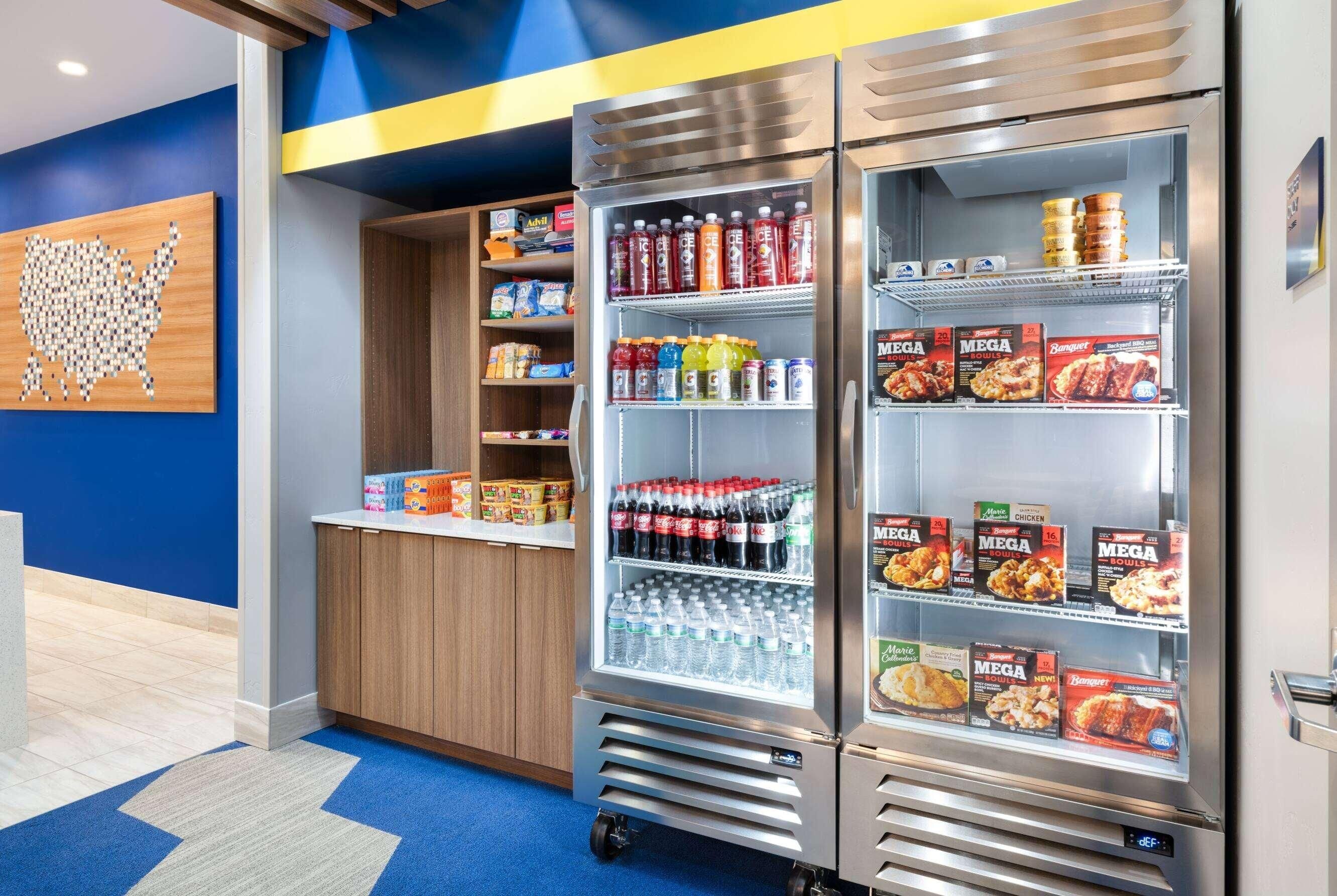 A vending machine with various food and drink options, including snacks, beverages, and boxed meals.