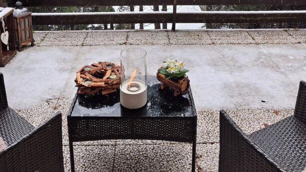 An outdoor seating area with a table, chairs, and a bench. - Wuthering Heights Apartment, lovely apartment at the foot of the ski slopes (Angolo Terme)