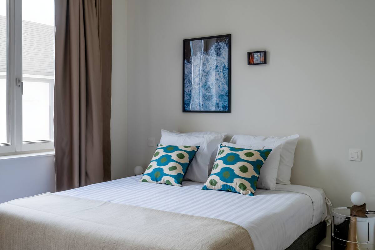 2 bedrooms, blackout drapes, soundproofing, iron/ironing board