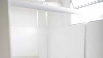 Shower, towels, soap, toilet paper