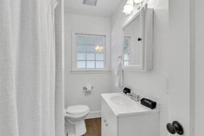 Shower, hair dryer, towels, shampoo