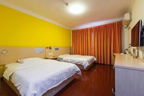 A hotel room with two beds, a desk, and a television. - 7Days Inn Chain Hotel (Kunming Dongjiawan Telecom Building) (Kunming)