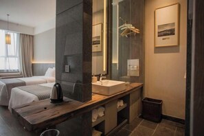 A modern hotel room with a large mirror, a wooden vanity, a bed, and a window with curtains. - Hotel Select Ankang Lianhua (Ankang)
