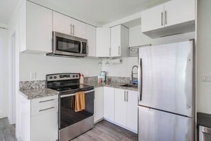 Fridge, microwave, oven, stovetop - Bright North Park Studio with Parking, AC & Yard (San Diego)