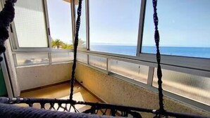 A room with a view of the beach and ocean through large windows. - VV Miramar Sunset Tabaiba (Tabaiba)