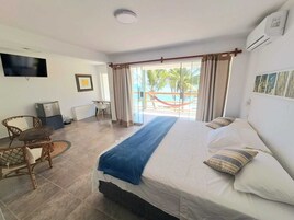 Deluxe Room, Balcony, Beach View | Individually decorated, individually furnished, desk, laptop workspace