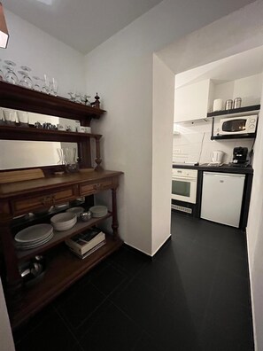 Fridge, microwave, oven, cookware/dishes/utensils