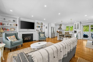 TV, fireplace, books
