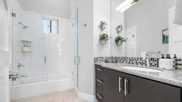 Shower, hair dryer, towels, shampoo