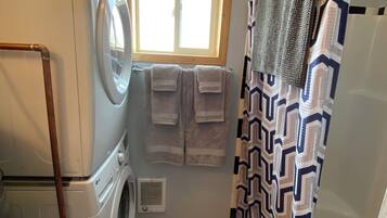 Shower, hair dryer, towels, soap