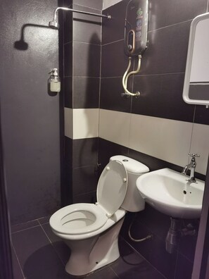 Shower, rainfall showerhead, bidet, towels