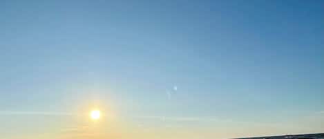 On the beach, sun-loungers