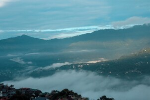 A mountainous landscape with a village nestled in the valley.