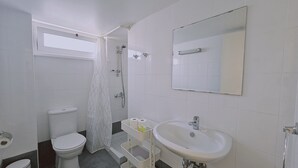 A bathroom with a toilet, shower, sink, and a window. - 142 NIC 2 - Stay City Life 2 Apartment (Nicosia)