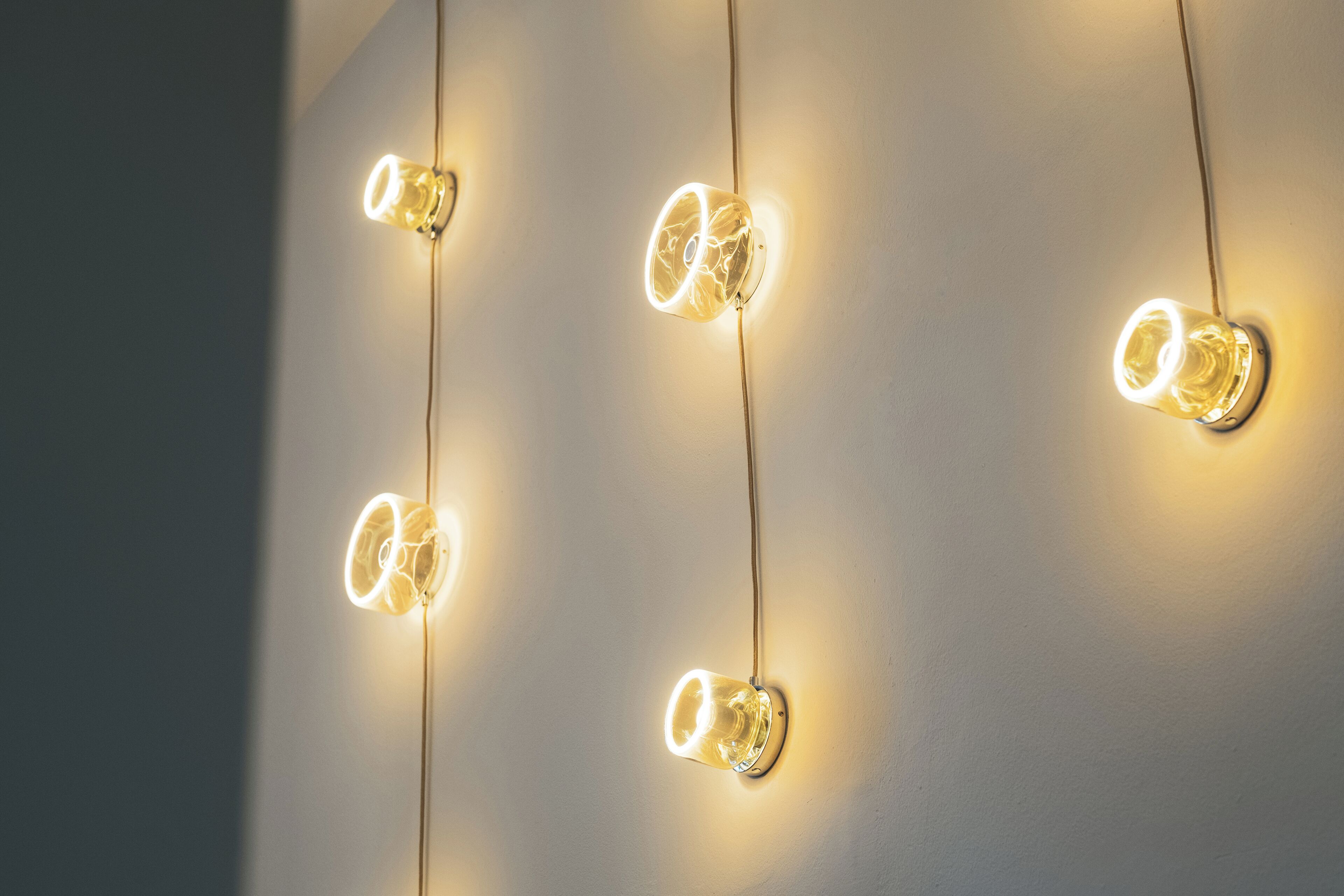 A wall with multiple light fixtures.