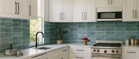 Fridge, stovetop, dishwasher, coffee/tea maker