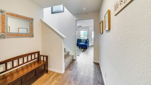 A hallway with a wooden bench, a mirror, and a motivational quote on the wall. - San Antonio Home w/ Pool Access: 11 Mi to Seaworld (San Antonio)