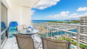 A balcony with a view of a marina and distant mountains. - Ocean and Sunset Marina Views at the Ilikai Hotel w/Great Building Amenities (Honolulu)