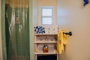 Shower, hair dryer, towels